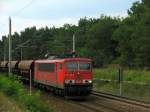 155 182-9 mit einem Kiesgterzug auf der Reise nach Norden durch Bestensee am 30.07.