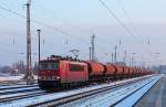 Die 155 089-6 mit einem Tads-Ganzzug bei der Durchfahrt am 24.01.2014 in Oranienburg.
