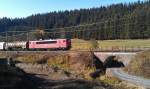 Eine BR 155 von DB Schenker ist am 20.09.2012 mit einem gemischten Gterzug auf der sdlichen Frankenwaldrampe unterwegs.