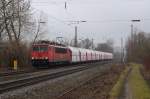 155 066-4 durchfuhr am trben 16.02.2013 mit dem Kalkzug von Rohdenhaus nach Bremen den Bahnhof Mersch in Richtung Mnster.