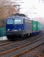 Kurz vor der Einfahrt in den Bahnhof Grevenbroich kommt am spten Nachmittag des 4.Mrz2011 1142 635-0 mit einem Containerzug gen Rheydt gefahren.