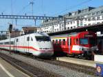 DB - ICE 401 bei der Einfahrt in dem Bahnhof von Thun neben dem roten bls Steuerwagen ABt 923 am 20.09.2007