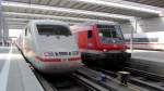 Ein ICE 1 als ICE 592 von Mnchen Hbf nach Berlin Hbf und ein Wittenberger Steuerwagen am Ende von RB 59152 von Mnchen Hbf nach Treuchtlingen am 24.7.2012 im Mnchner Hauptbahnhof.