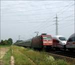 101 145 mit EC 115 nach Klagenfurt Hbf und rechts ICE nach Dortmund.Am 05.07.09 in Lampertheim.