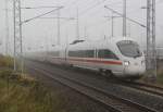 411 059-9 als ICE 1611 Warnemnde-Mnchen bei der Ausfahrt im Rostocker Hbf.29.10.2011