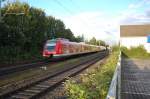 422 038-0 mit Anhang verlassen gerade Kleinenbroich in Richtung Mnchengladbach.