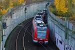 Eine S11 nach Bergisch Gladbach ist hier beim Verlassen vom Flughafen Dsseldorf an der Unterfhrung des Kieshecker Weg und der S-Bahnstrecke und Fernbahn nach Duisburg.