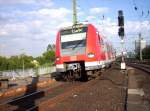 425 297/797 bei der Einfahrt von Kln Hbf bei Sonnenschein des 31.07.2006