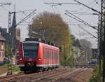 425 077-5 als RB11063 nach Aachen am Km 29.0 kurz vor Geilenkirchen 18.4.10