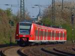 425 077-5 legt sich am 23.04.2010 als RB33 vor Aachen West in die Kurve.