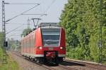 425 577 als RB11064 aus Aachen nach Duisburg am Km 28.8 zwischen Geilenkirchen und Lindern, Gre an den Tf, 22.5.10