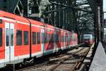 S-Bahn und Regio-Verkehr auf der Hohenzollerbrücke in Köln, hier mit BR 425 und BR 644 - 31.07.2014