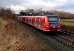 Ein RE 8 nach Kobenz Hbf geführt vom 425 038-7 bei Gubberath am 5.12.2011