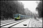 ET 001 der Westfalenbahn und eine weitere fünfteilige Einheit der WFB hatten am 15.2.2016 um 8.30 Uhr gerade den Lengericher Tunnel durchfahren und erreichten hier die Einfahrtkurve zum Bahnhof