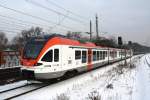 Tw 404 der VIAS (428 138-2) als Ersatzverkehr fr die ODEG auf der RE4 Rathenow-Ludwigsfelde am 14.12.2012 bei der Ausfahrt Rathenow