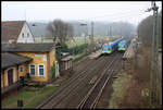 Zwei Flirt der Westfalenbahn, links ET 016 nach Osnabrück und rechts ET 019 nach Münster, kreuzen hier am 26.12.2007 um 10.28 Uhr im Bahnhof Natrup Hagen.