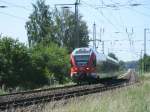 429 030,als RE 13025 Stralsund-Binz,am 04.Juni 2011,vor Bergen/Rgen.