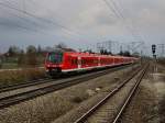 Der 440 522 als RE nach Augsburg am 18.04.2010 bei der Durchfahrt in Mnchen Langwied.