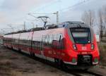 442 837-1 als S 1 von Rostock Hbf nach Warnemnde bei der Einfahrt im Haltepunkt Warnemnde Werft am 23.12.2013 