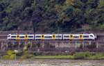 Ein Triebzug von Siemens  Desiro ML der TransRegio  460 501-0  der Mittelrheinbahn bei Unkel am Rhein abgelichtet am 22.09.2013.
