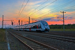 Nachschuss auf den Abellio Triebzug 9442 810 der als Re 20 gerade den Bahnhof Neudietendorf verlässt in Richtung Eisenach.Bild vom 14.9.2016