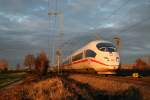 403 506-9 durchfhrt als ICE 107/207 von Dortmund/Dsseldorf nach Basel SBB im schnsten Abendlicht des 07.12.13 den Bahnhof Mllheim (Baden).