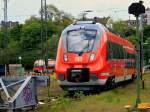 Zwei Hamsterbacken, 442 260 und 442 263, beide schon mit dem RSX Logo (Rhein-Sieg-Express) fr die RB9 beklebt, stehen am 15.05.2012 bewacht von einem Sicherheitsdienst im Bereich des Bw am Aachener Hbf. Das Foto wurde durch den Zaun an der Kamperstrasse gemacht.