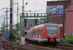 423 550-3 und 423 047-0 als S12 aus Sindorf nach Hennef bei der Einfahrt in Kln Hbf, 23.7.10