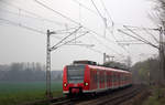 Die Rhein Niers Bahn (RB33) kommt aus Duisburg-Hbf,Heinsberg(Rheinland) nach Aachen-Hbf und kommt aus Rheydt,Wickrath,Beckrath,Herrath,Erkelenz,Baal,Hückelhoven-Baal,Brachelen,,Lindern,Süggerath,Geilenkirchen,Frelenberg,Zweibrüggen,Übach-Palenberg und fuhr in Richtung Finkenrath,Hofstadt,Herzogenrath,Kohlscheid,Richterich,Laurensberg,Aachen-West,Aachen-Schanz,Aachen-Hbf.
Aufgenommen von Bruchhausener Straße in Rimburg im Wurmtal. 
Bei Wolken am Nachmittag vom 9.4.2018.