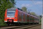 425 041 als  Rhein-Niers-Bahn  RB11073 nach Aachen Hbf am B km 28.2 kurz vor dem Bf Geilenkirchen 19.4.2009