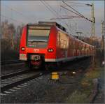Quitschologie: Einfacher Mittelhessenexpress mit 425 016-3 (Fotostandort ist ein ffentlicher Parkplatz, Dezember 2009).
