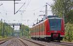 425 075-9 als RB11069 nach Aachen bei der Ausfahrt in Geilenkirchen, 16.5.10