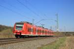 425 019 legt sich als RB42  Haard-Bahn  auf dem Weg von Mnster nach Essen kurz vor Nottuln-Appelhlsen in die Kurve.
Nottuln-Appelhlsen, 27.03.2011