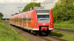 Kurz vorm Bahnhof Herrath ist hier den  425 604 nach Aachen Hbf zu sehen. 24.5.2013