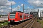 Einfahrt der S4 nach Bruchsal am 24.05.2014 in Ludwigshafen (Rhein) Mitte, die an diesem Tag aus 425 220-1 bestand.