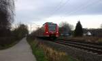 Die Rhein Niers Bahn (RB33) aus Duisburg-Hbf,Heinsberg-Rheinland nach Aachen-Hbf und kommt aus Richtung Rheydt,Wickrath,Beckrath,Herrath,Erkelenz,Baal,Hückelhoven-Baal,Brachelen,Lindern,Süggerrath,Geilenkirchen,Frelenberg und wird gleich in Übach-Palenberg halten und fährt dann weiter in Richtung Rimburg,Finkenrath,Hofstadt,Herzogenrath, Kohlscheid,Richterich,Laurensberg,Aachen-West,Aachen-Schanz,Aachen-Hbf. 
Aufgenommen Zwischen Übach-Palenberg und Zweibrüggen. 
Bei Sonne und Wolken am Nachmittag vom 29.12.2015.