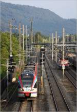 ET 134 der BLB ist am Abend des 5. August 2011 als S3 in Salzburg-Gnigl in Fahrt.
