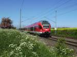 429 028 bei sommerlichen Wetter unterwegs bei meiner Heimatstadt Bergen/Rgen als RE 33216 Sassnitz-Rostock.