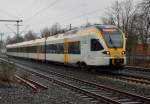 Der Eurobahntriebwagen ET 7.09 als RE13, ist hier in Korschenbroich auf seinem Weg nach Hamm in Westfalen zusehen. 10.3.2013