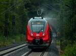 Bei Regen jagt Rhein-Sieg-Express Hamsterbacken-Doppel 442 754 und 442 755 am 31.08.2012 auf der KBS 480 bei Eilendorf dem nchsten Ziel Stolberg entgegen.