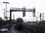 Der RE9 kommt aus Richtung Köln und fährt in Aachen-Hbf ein und auf dem Abstellgleis im Aachener-Hbf im Gegenlicht am Morgen vom 11.8.2014.