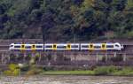 Ein Triebzug von Siemens  Desiro ML der TransRegio  460 501-0  der Mittelrheinbahn bei Unkel am Rhein abgelichtet am 22.09.2013.  