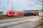 Der Fuhrpark vor den Hallen des Wagenwerks in Pasing am 31.05.2008 zum Jubil�um: Erstlings - S-Bahn 420 001, Dosto mit 111 027-9 (leider verdeckt), E 18 047 mit 1.Kl Wagen 25001 M� und V 100 1365 mit