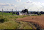 Zwischen Kornfeld und Windrädern:  9442 113 (Bombardier Talent 2) der Abellio Rail Mitteldeutschland GmbH als RB 74789 (RB75) von Lutherstadt Eisleben nach Halle(Saale)Hbf fährt bei Eisdorf