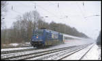 101001-6 mit MERIAN Werbung fährt hier am 31.1.2003 um 10.16 Uhr mit einem Intercity durch den Bahnhof Natrup Hagen in Richtung Münster.