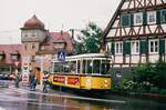 Gerlinger Sonderfahrt im Regen (1988 ?): TW 802 (MF Esslingen Serie T2) und zwei Beiwagen der Reihe B2 quälen sich durch die enge Kurve nach der Gerlinger Straßenbahnstation neben der