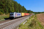 187 513 Akiem/Metrans mit einem Containerzug bei Hagenbüchach Richtung Würzburg, 19.09.2020