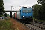 Railtraxx 185 515-4 am 12.07.2014 mit einem Containerzug in Orschweier gen Süden.