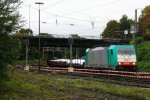 Die Cobra 2827 kommt aus Richtung Kln,Aachen-Hbf mit einem langen gemischten Gterzug aus Kln-Gremberg nach Antwerpen-Noord(B) und fhrt in Aachen-West ein bei Regenwetter in der Abendstimmung am