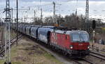 ÖBB-Produktion GmbH, Wien [A] mit ihrem Vectron  1293 041  [NVR-Nummer: 91 81 1293 041-0 A-ÖBB] und einem Getreidezug am 20.02.24 Durchfahrt Bahnhof Falkenberg/Elster.